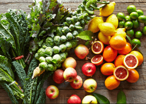 a group of fruits and vegetables on a wood surface Healthy Weight Loss Diets Buckinghamshire
