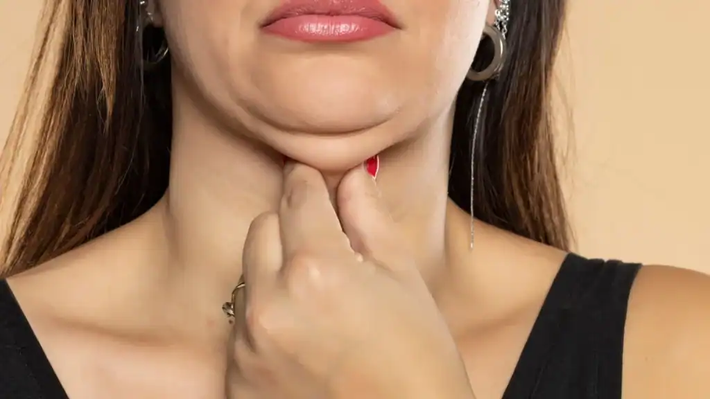 An image of a woman with double chin, sad, worried : Non Surgical Double Chin Removal Treatment in Buckinghamshire, UK